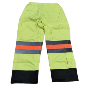 Waterproof trousers in yellow HV polyester, compliant with the green MTMD standard